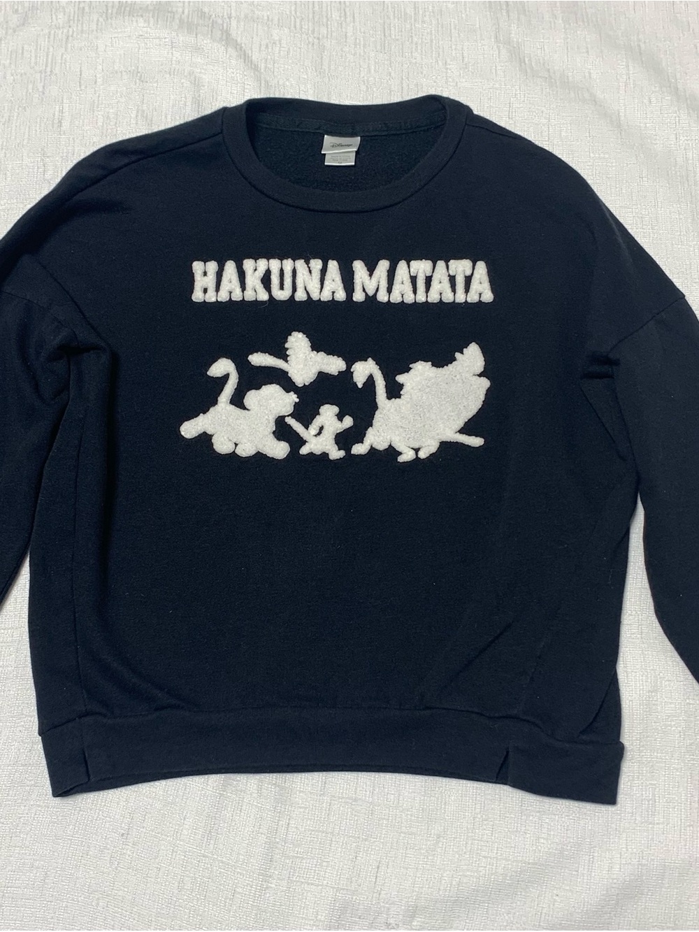 Disney Black Crewneck Sweater with White "Hakuna Matata" Graphic
